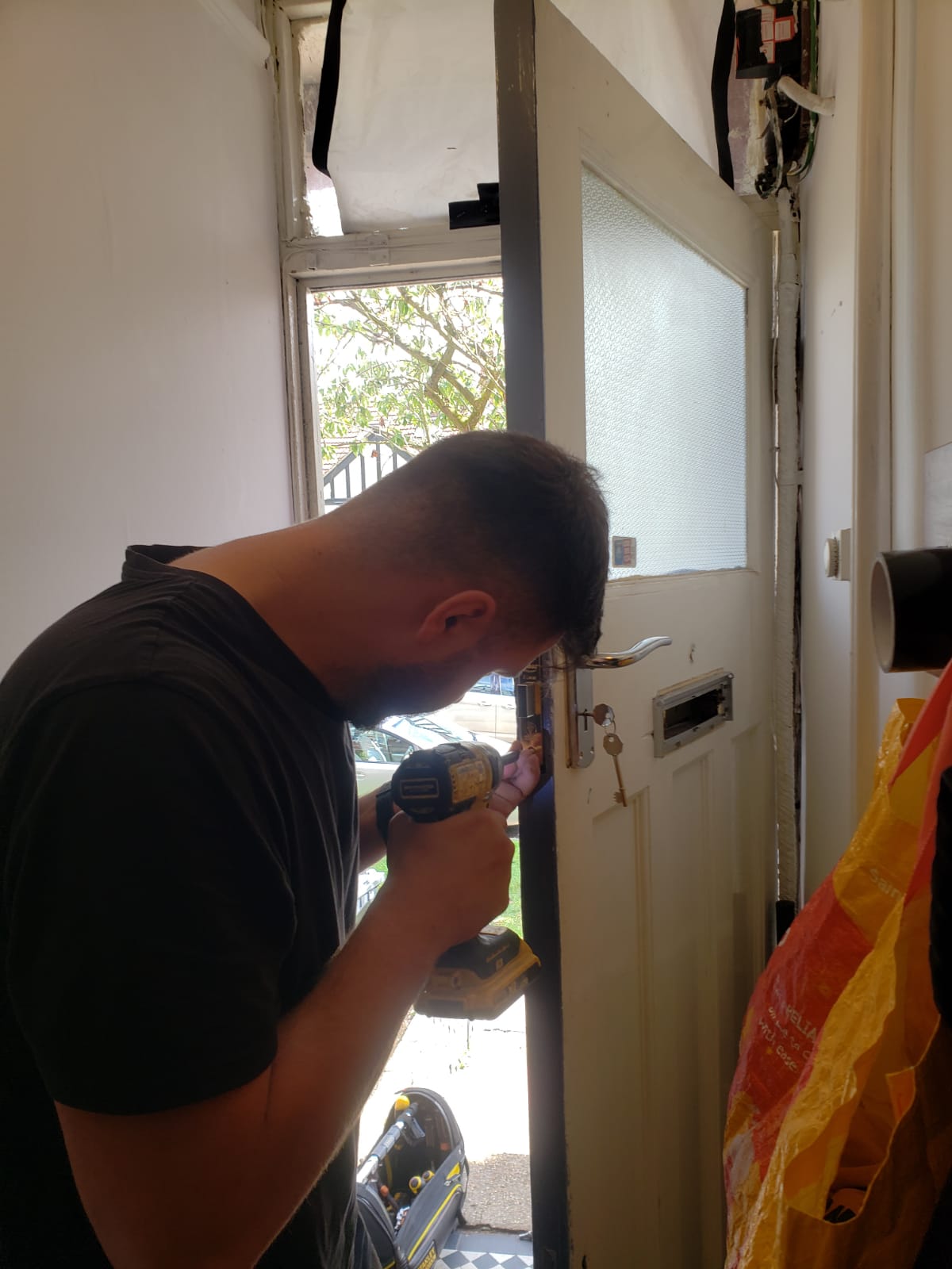 Dan installing a new lock